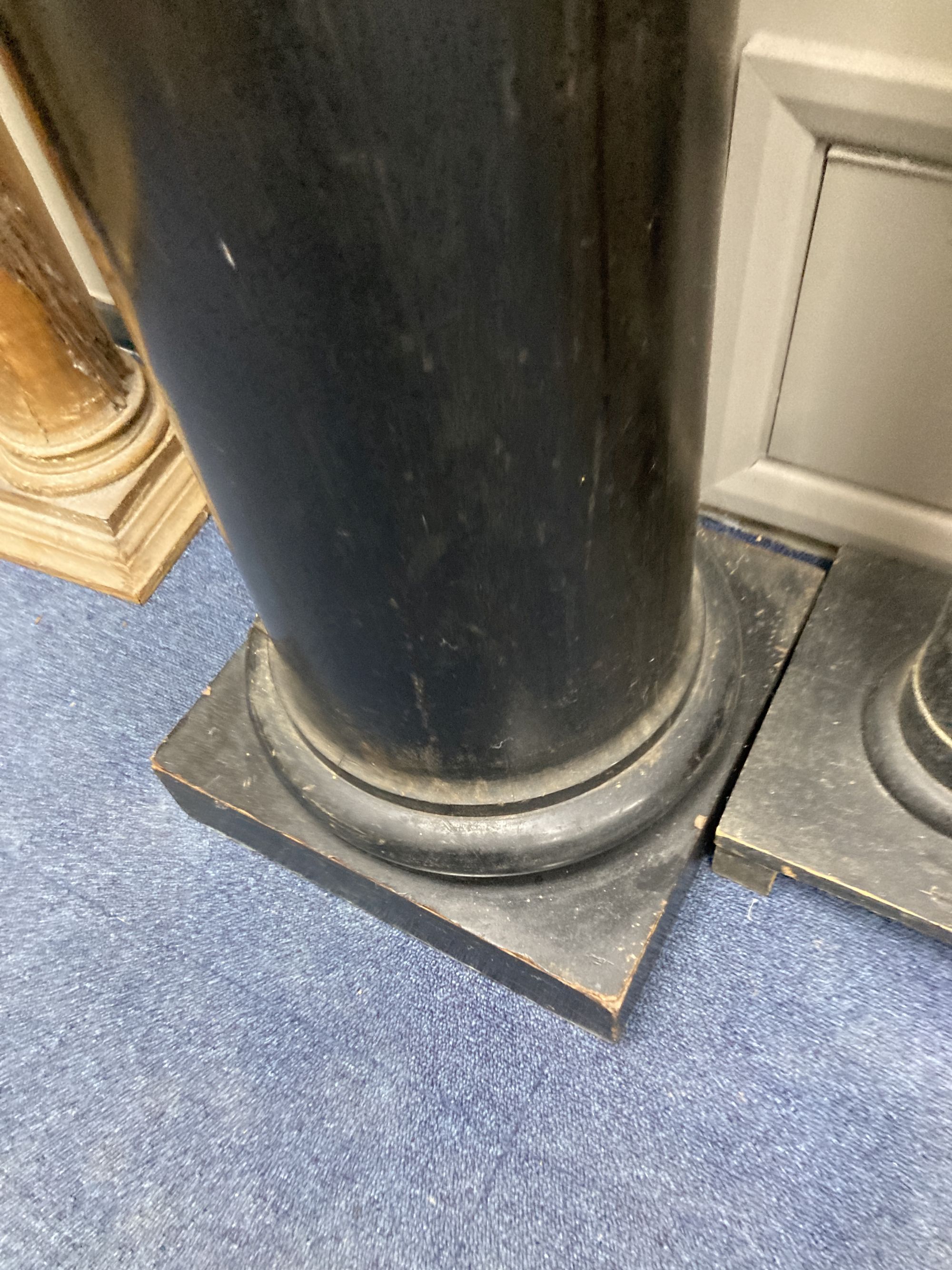 An ebonised wood column, height 99cm